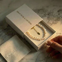 Thumbnail for Sunseeker Pearl Choker by Brother & Sisters in elegant packaging with unique baroque pearls.