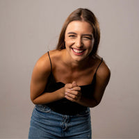 Thumbnail for Girlfriend Photo Necklace worn by a smiling woman in a stylish outfit, showcasing its personalized pendant.