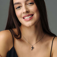Thumbnail for Minimalist Initial Necklace worn by a woman, showcasing elegant personalization, from Brother & Sisters.