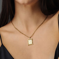 Thumbnail for Vintage Initial Necklace featuring a delicate gold letter charm by Brother & Sisters, perfect for elegant everyday wear.