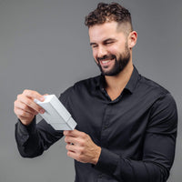 Thumbnail for Man Blue Photo Bracelet gift being unwrapped by a smiling man in black shirt, featuring personalized photo pendant.