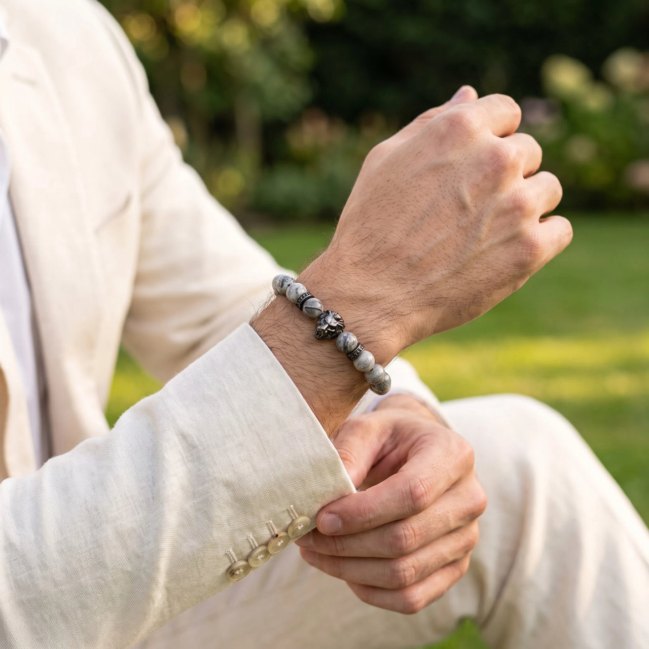 Black Lion & Grey Stones Bracelet – worn with a shirt cuff | Brother & Sisters | SKU: 20866222-gun-black-XS-14-15, 20866222-gun-black-S-16-17, 20866222-gun-black-M-18-19, 20866222-gun-black-L-20-21, 20866222-gun-black-XL-22-23