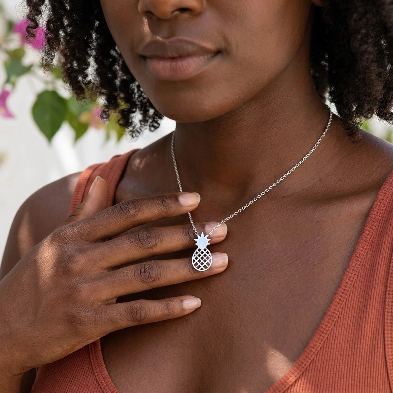 Woman gently touching her silver necklace | SKU: 8050907-white-gold