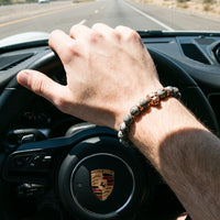 Thumbnail for Rose Gold Lion & Grey Stones Bracelet – worn at the steering wheel of a luxury car | Brother & Sisters | SKU: 20866222-rose-gold-XS-14-15, 20866222-rose-gold-S-16-17, 20866222-rose-gold-M-18-19, 20866222-rose-gold-L-20-21, 20866222-rose-gold-XL-22-23