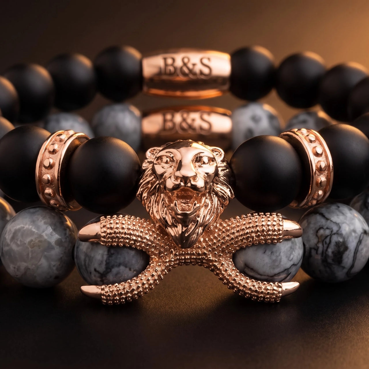 Rose Gold Lion with Black & Grey Stones Set – macro detail of the lion head | Brother & Sisters | SKU: 21369621-rose-gold-XS-14-15, 21369621-rose-gold-S-16-17, 21369621-rose-gold-M-18-19, 21369621-rose-gold-L-20-21, 21369621-rose-gold-XL-22-23
