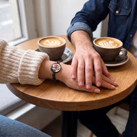 Thumbnail for Couple holding hands at a cafe table, the black octagon photo bracelet on her wrist | SKU: TPH-OCTB-BLACK-18