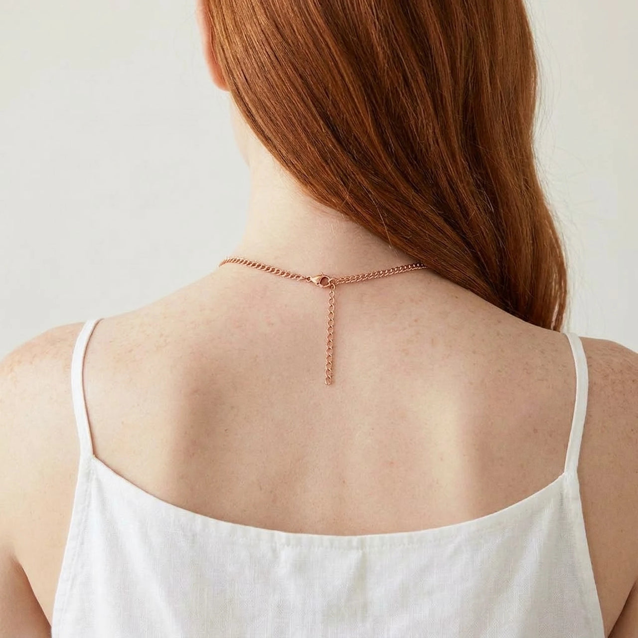 Back of the neck showing the lobster clasp and extension chain of the rose gold photo necklace | SKU: TPH-OCTN-ROSEGOLD